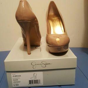 Nude patent peep toe platforms
