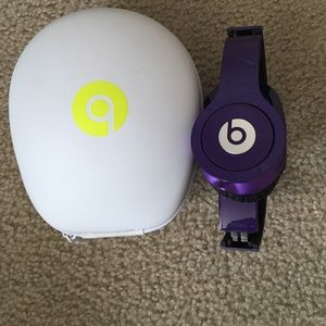 Beats purple headphone with case.