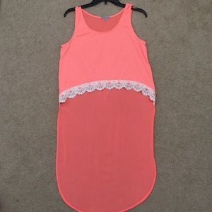 High low neon orange top with white lace