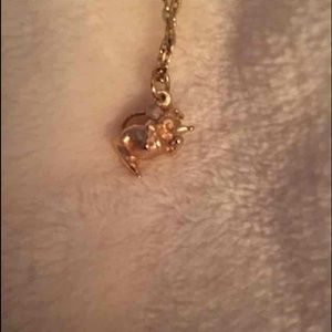 Gold plated Disney Couture necklace.