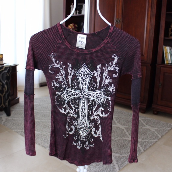 Rhinestone cross long-sleeve top.