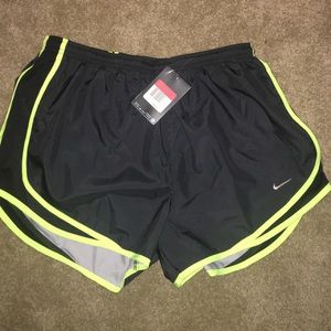 Black and neon yellow Nike running shorts