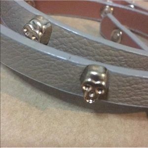 Light brown/cream colored belt.