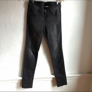 Black destroyed skinny jeans