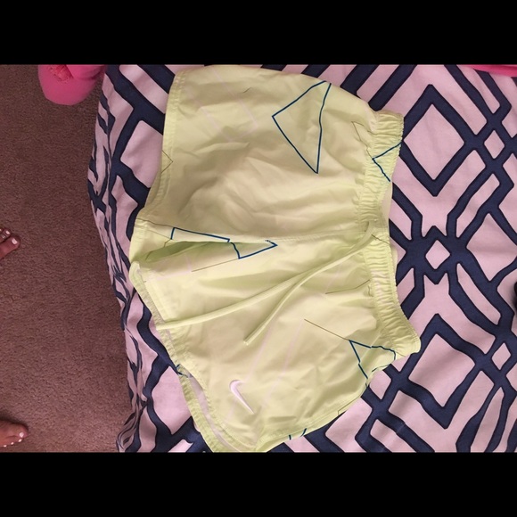 neon yellow geometric print Nike shorts.