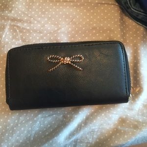 Black wallet with rose gold bow