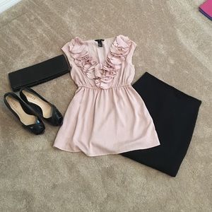 Elegant soft pink top with ruffle detail