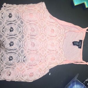 peach/coral colored crop top