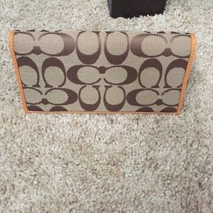 Coach check cover