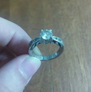 CZ ring with channel set stones on sides