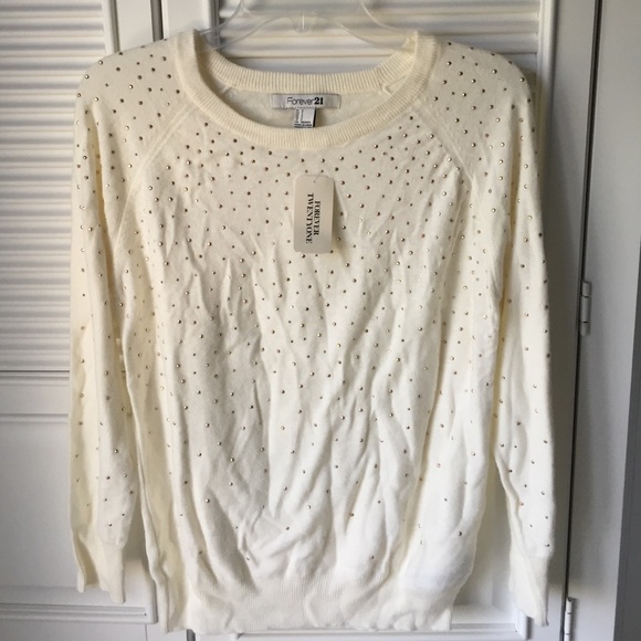Soft, cream shirt. Bedazzled with gold beads.