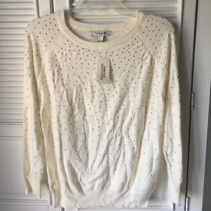 Soft, cream shirt. Bedazzled with gold beads.