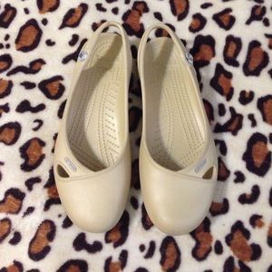Tan colored crocs slip ons