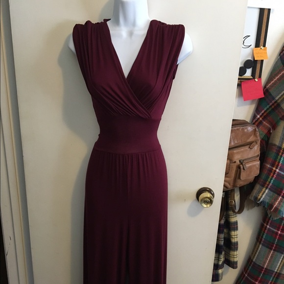 One piece jump suit in a deep Burgundy.