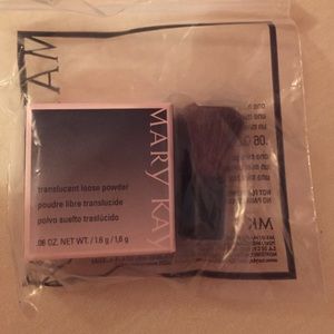 Mary Kay translucent loose powder with brush.