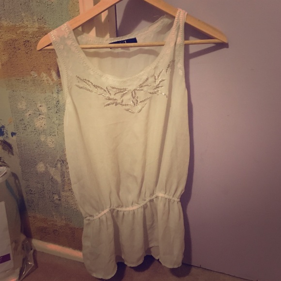 Loose white sheer tank top with cinched waist