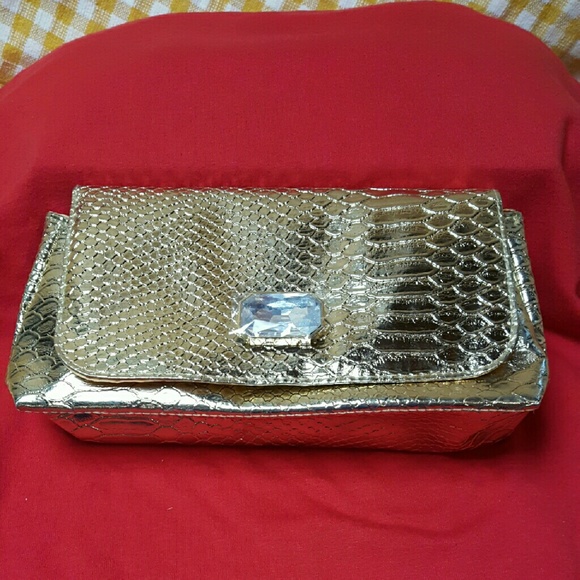 Gold tone croc clutch