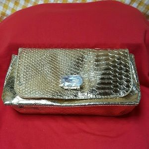 Gold tone croc clutch