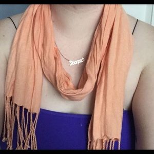 Orange fringed scarf