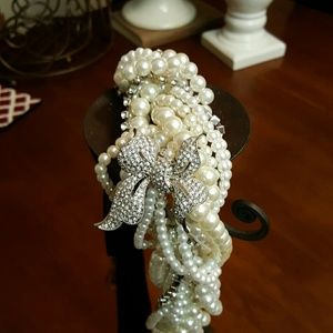 Multi strand pearl  choker with rhinestone bow