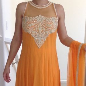 A lovely orange shalwar kameez.