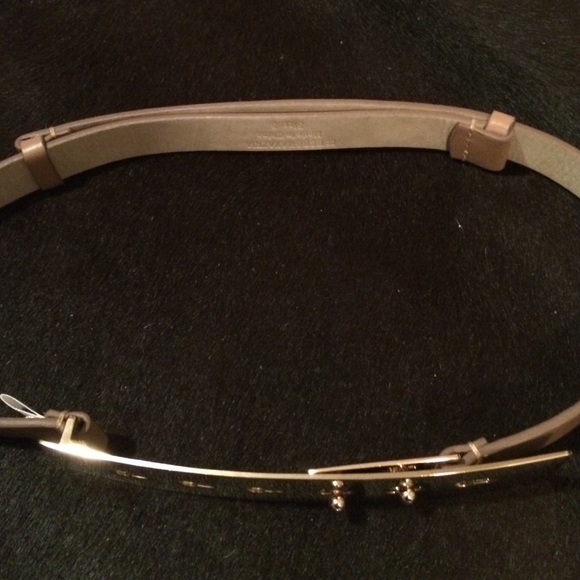 Faux leather tan belt gold buckle.  Small bcbg