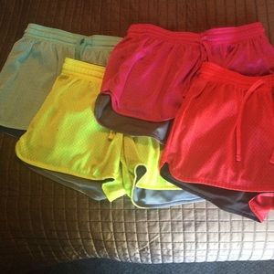 FOUR pairs of Champion athletic shorts.