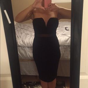 Form fitted knee length black dress