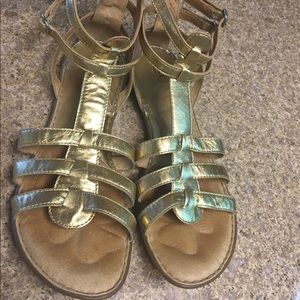 Gold gladiator sandals.