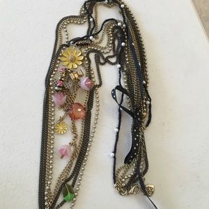 Long, multistrand necklace with bee & flower charm