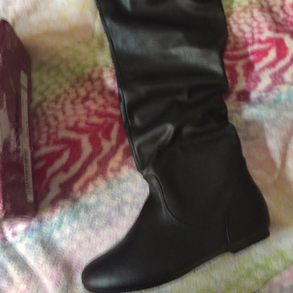 Knee high boots never worn still in box