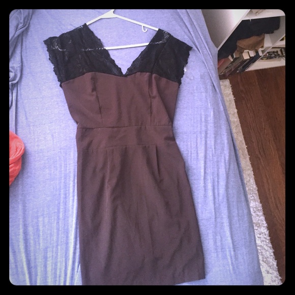Dark purple dress with lace detail and low back.