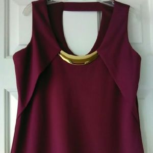 Sleeveless top with attached jewelry