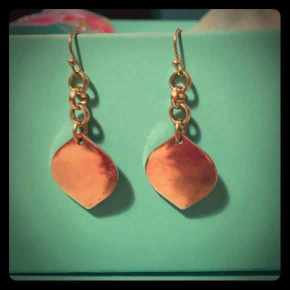 Dangle golden tone earrings