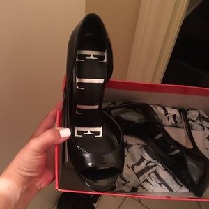 Black high heels and two Express dresses