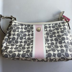 Gray and white coach purse