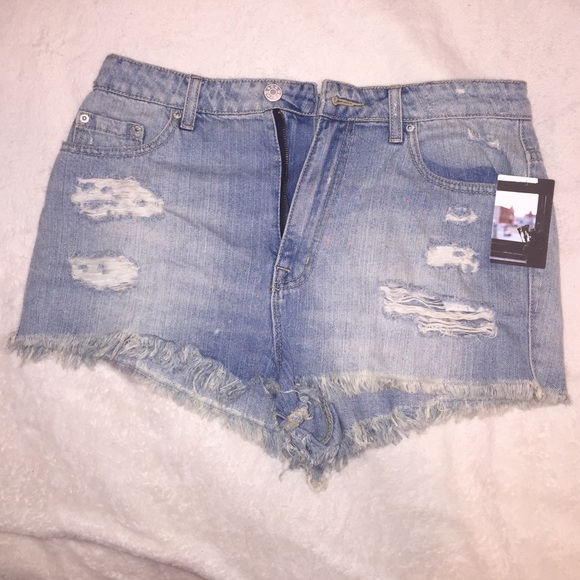 distressed cheeky denim shorts