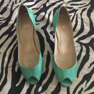 Teal Christian Louboutin heels.