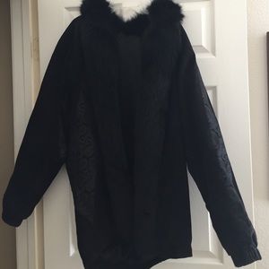 Leather jacket with fox trim.