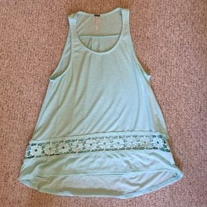 Light green high low shirt with floral detial