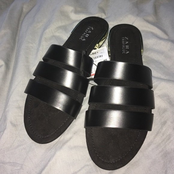 Black strappy flat sandals / slides