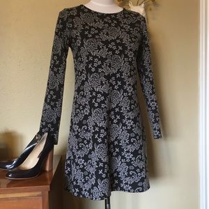 Short long sleeved mod dress with floral pattern