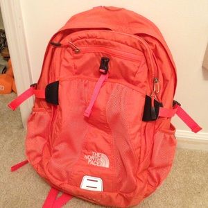 Bright pink/coral Northface recon book bag