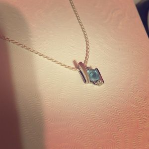Aquamarine stone with two offset diamonds necklace