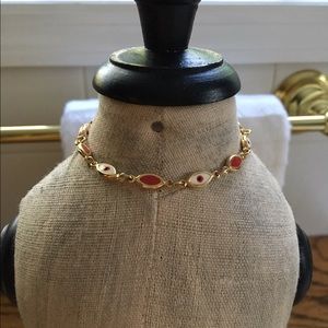 Unique red, white, and gold bracelet