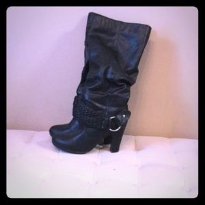 Tall black boots with buckle