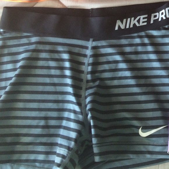 Gray and black striped Nike pros