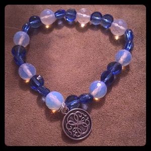 Opalite and blue beads with a path of life charm