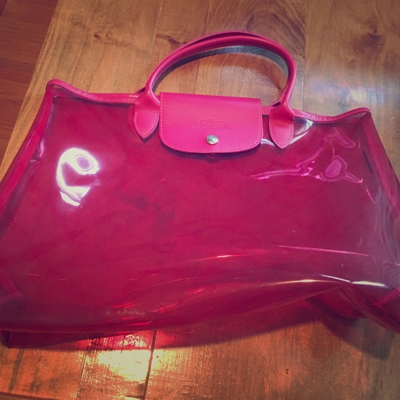 A pink/clear longchamp bag