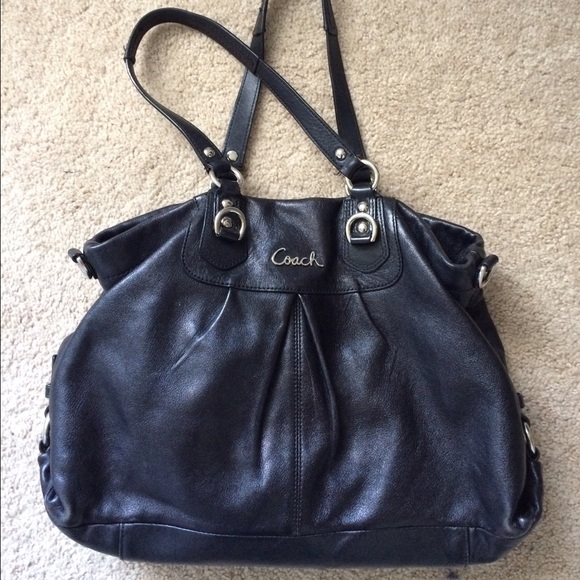 Coach handbag with detachable shoulder strap.